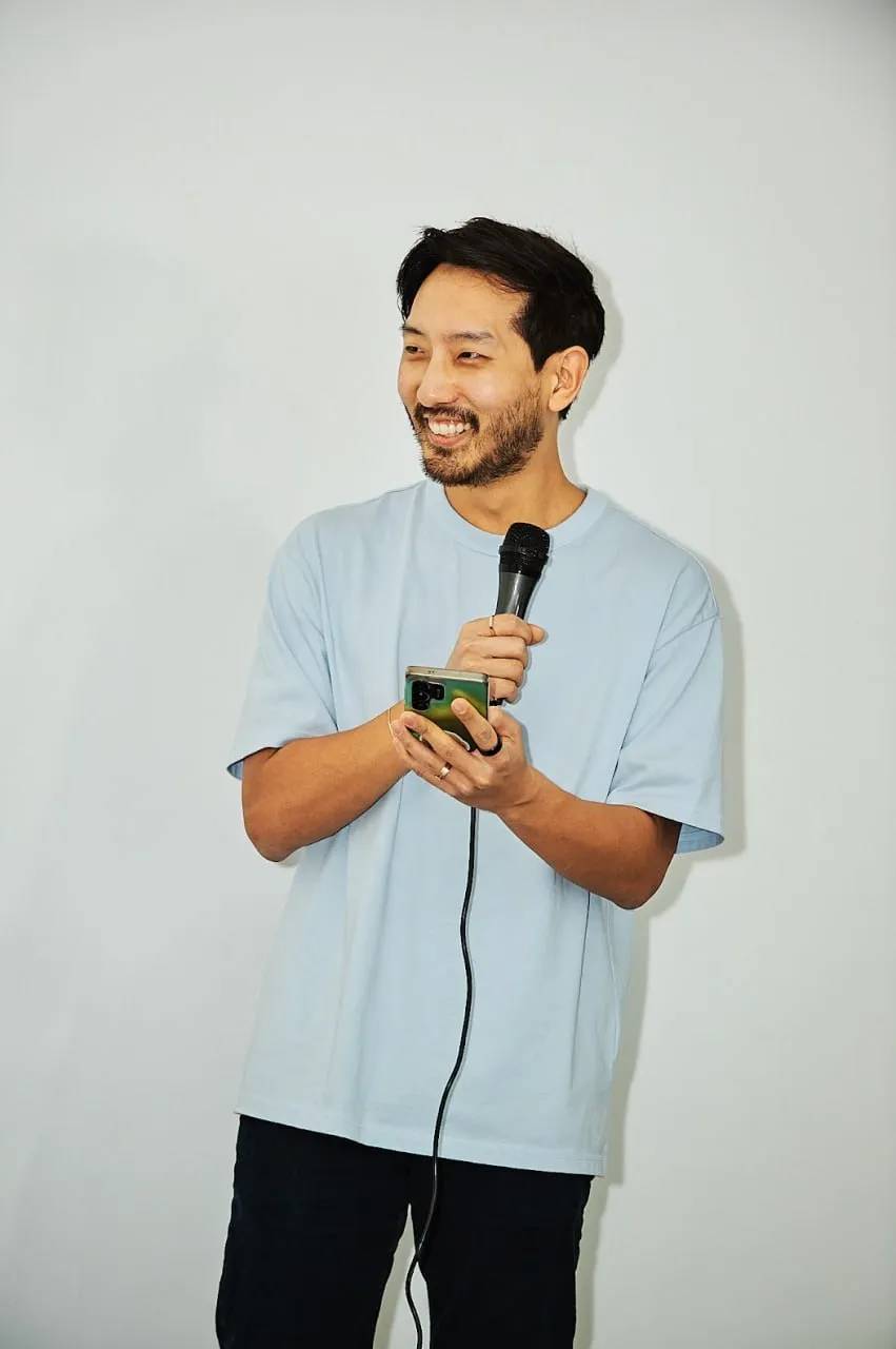 Robin speaking into a microphone at the OpenClaw LA meetup