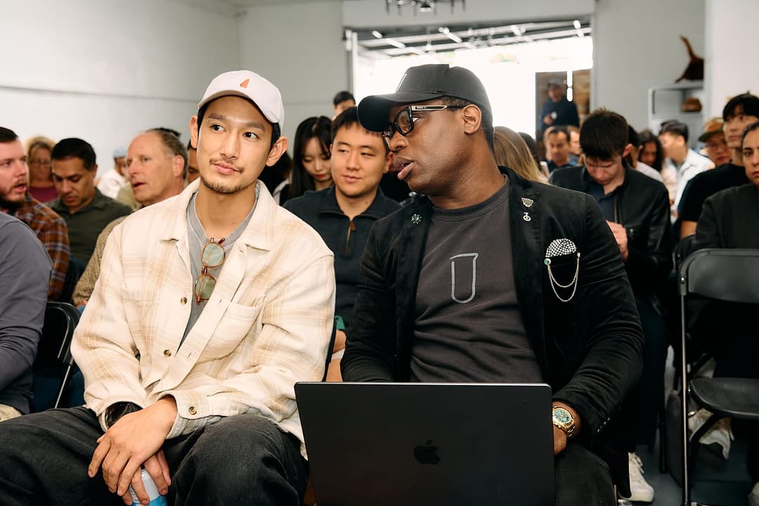 Two attendees talking before the next demo starts