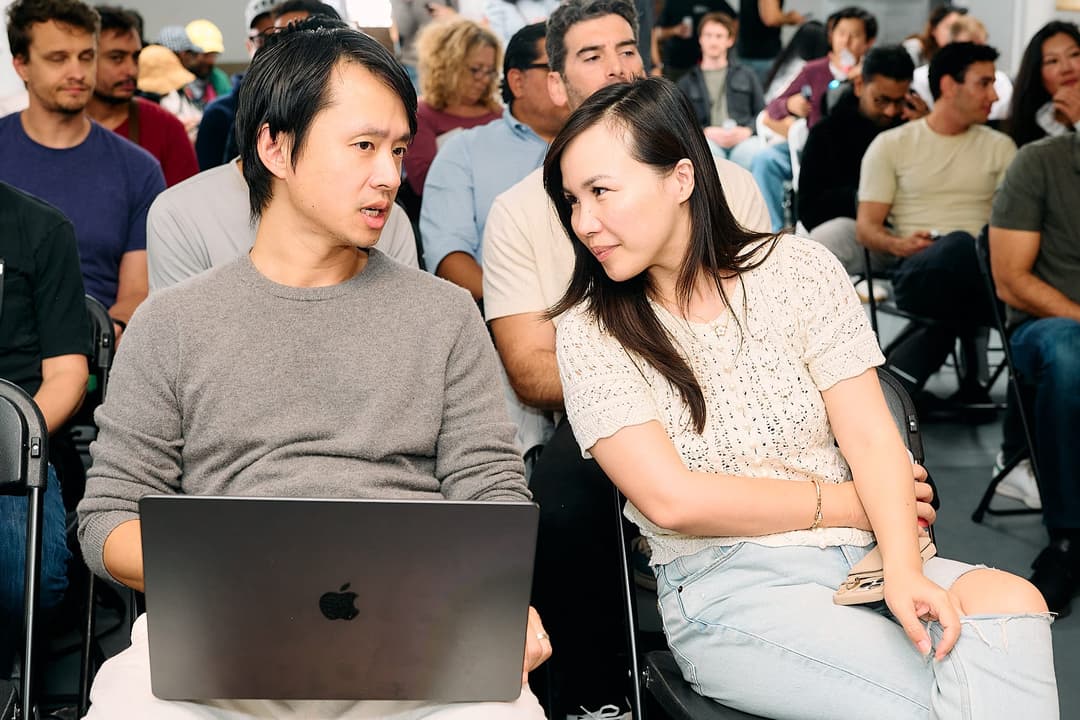 Andrew and Catherine talking in the front row before the next demo