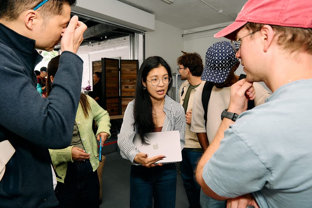 Ziwei discussing Accio Work with a small group