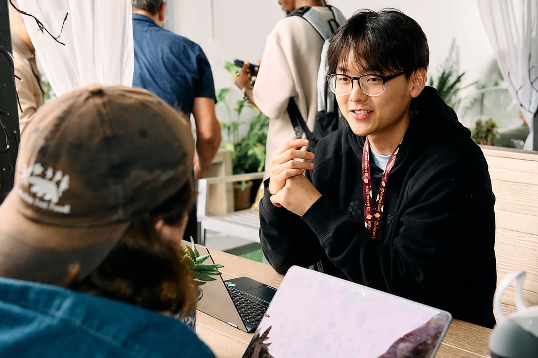 Attendees working together at a table after the talks