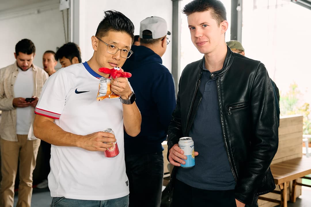 Andy holding a lobster plushie and snack during the meetup