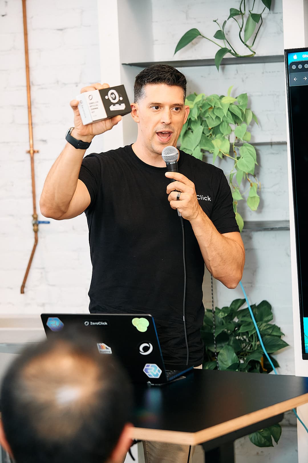 Michael holding up a Lego Zero mascot to give away