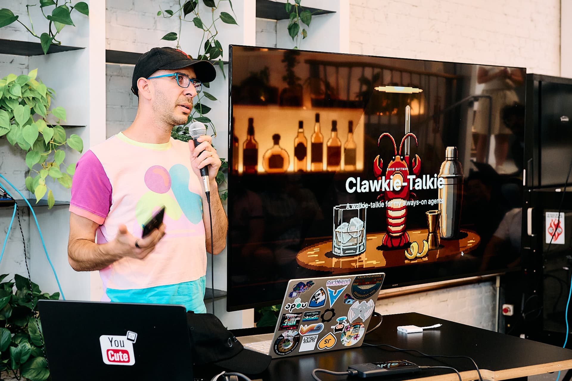 David Guttman presenting Clocky Talky with the Clawkie-Talkie slide on screen