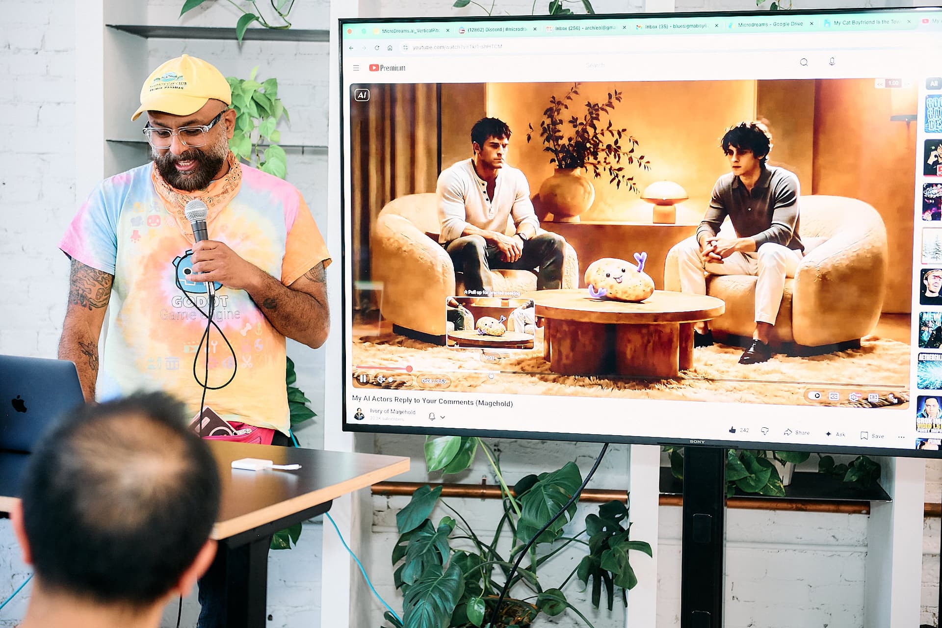 Archie presenting his AI microdrama, with the AI actors and a potato on screen